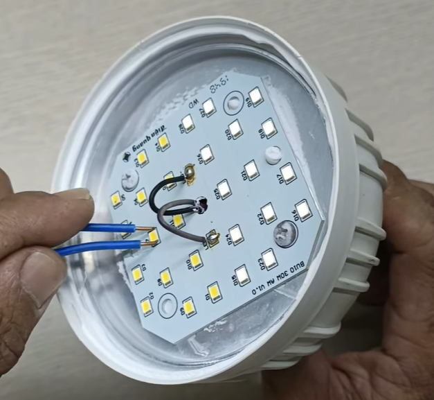 Manual assembly of electronic components on LED board